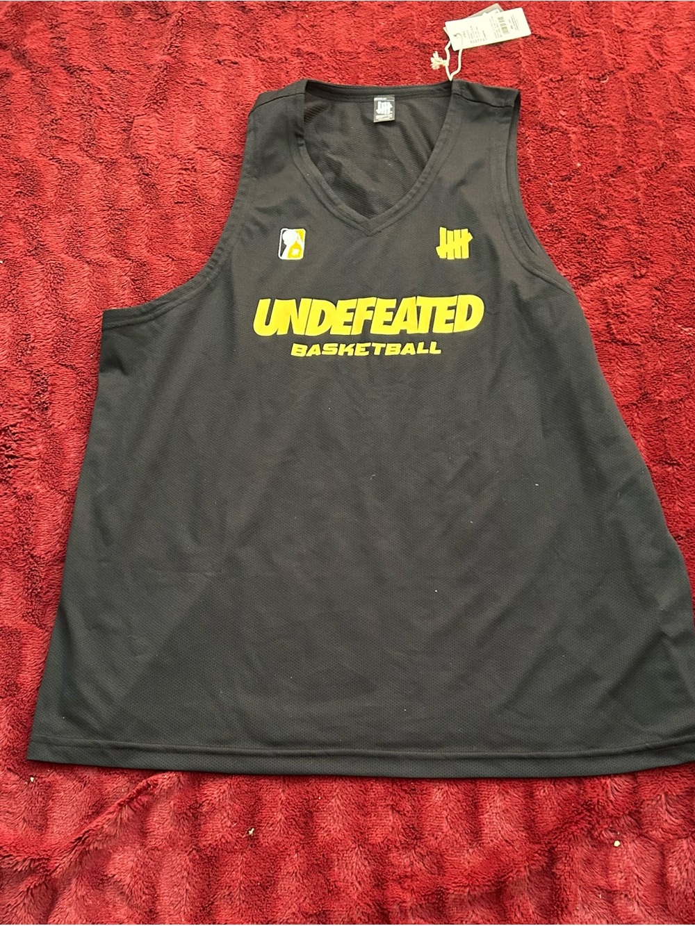 Undefeated Black Basketball Jersey with Yellow Logos
